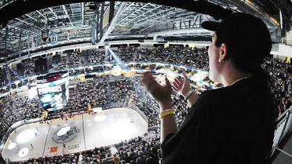 Janel Capezzuto from Apollo cheers on the Penguins in their first preseason game against the Red Wings at Consol Energy Center.