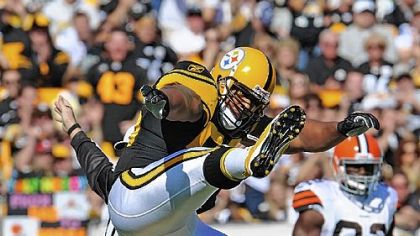 Linebacker LaMarr Woodley celebrates after sacking Browns quarterback Colt McCoy Sunday at Heinz Field.