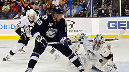 Penguins goaltender Marc-Andre Fleury stops Lightning forward Sean Bergenheim after Bergenheim was hooked on a breakaway by Penguins forward Evgeni Malkin during the second period. Bergenheim was awarded a penalty shot on the play, which Fleury also stopped.