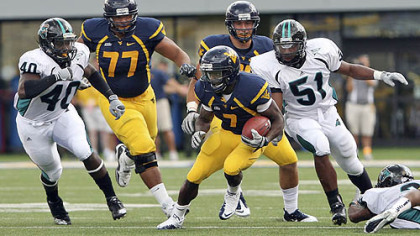 West Virginia's offensive line has helped running back Noel Devine, center, rush for 223 yards this season.