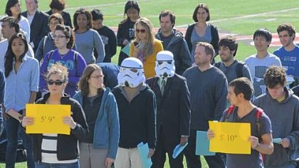 Theodore Dasher, 21, left, and Shazwan Azizan, 22, both Carnegie Mellon University students, wear Star Wars storm trooper masks while participating in a campus celebration of the first World Statistics Day Wednesday. About 150 CMU faculty and staff formed a human histogram based on their height.