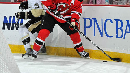 Devils forward Zach Parise controls the puck against Penguins defenseman Alex Goligoski during the second period.