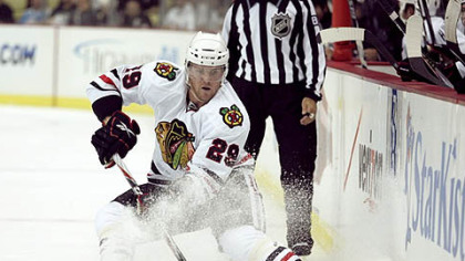 Blackhawks forward Bryan Bickell handles the puck.