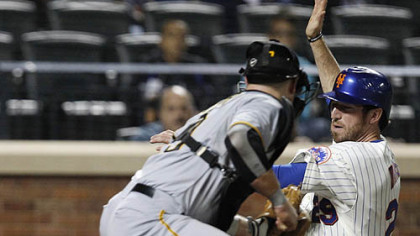 The Mets' Ike Davisscores on an error by Pirates catcher Chris Snyder during the fourth inning.