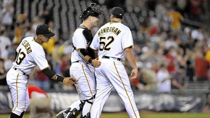 The Pirates' Ronny Cedeno and Chris Snyder congratulate Joel Hanrahan  after beating the Marlins, 7-1, Aug. 16 at PNC Park.