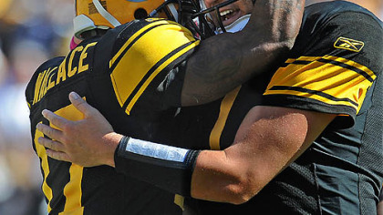 Mike Wallace is greeted by quarterback Ben Roethlisberger after making a touchdown catch in the second quarter.