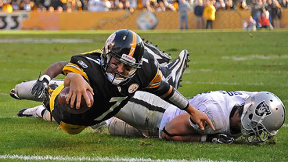Steelers quarterback Ben Roethlisberger dives in to the endzone for a touchdown in the first half.