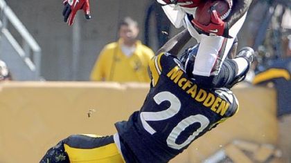 Steelers cornerback Bryant McFadden upends Atlanta's Jerious Norwood in the fourth quarter Sunday at Heinz Field.