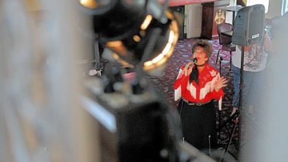 Taking on the personality of Patsy Cline, Cathi Rhodes performs for the Golden Triangle Luncheon Cruise as part of Gateway Clipper's weekly tribute to music legends. Ms. Rhodes also has hosted radio shows on polka and bluegrass.