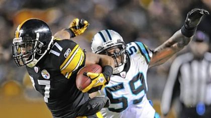 Mike Wallace blows past the Panthers' Nic Harris on his way to the end zone in the second quarter Thursday night at Heinz Field.