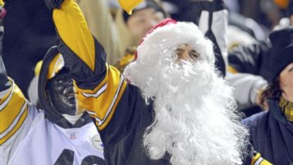 All he wants for Christmas ... a festive Steelers fan cheers on his team against the Carolina Panthers Thursday night.