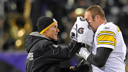 Steelers head trainer John Norwig stops the bleeding from Ben Roethlisberger's fractured nose Sunday in Baltimore.