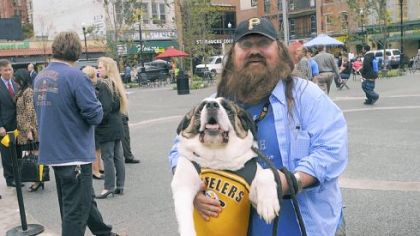 Charlie Godart and his dog Big Beyonce were promoting an upcoming film called "Charlie Godart and Big Beyonce: The Unauthorized Autobiography" at the dedication ceremony.