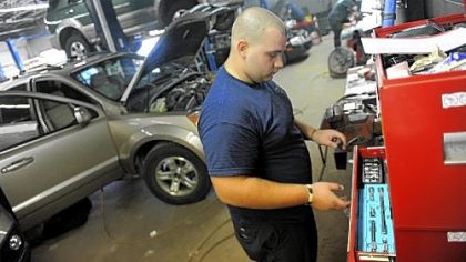 David Abbott, 19, of Houston, Washington County, works as an auto technician at South Hills Chrysler Jeep Kia in Peters.
