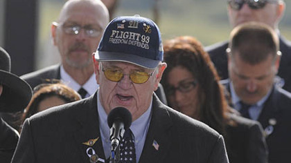 Gerald Bingham reads names of Flight 93's passengers during the Flight 93 National Memorial ceremony today in Shanksville.