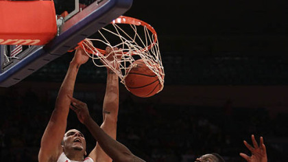 Maryland's Jordan Williams dunks the ball on Pitt's Talib Zanna in the second half.