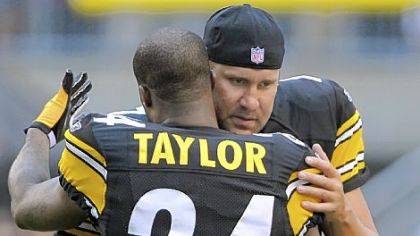 Steelers quarterback Ben Roethlisberger, shown here hugging teammate Ike Taylor before the start of the preseason game against Detroit at Heinz Field Saturday night, did not play and was mainly a source of encouragement on the sidelines.