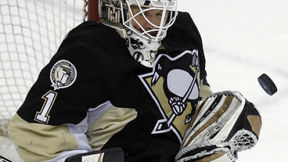 Penguins goaltender Brent Johnson makes a first-period save.