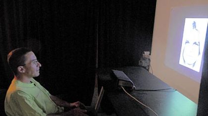 Jeff Hudale, who is autistic, demonstrates a facial recognition test last week at the University of Pittsburgh in which he is shown a series of faces expressing different emotions and then asked to decide which emotion he is seeing.