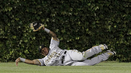 Pirates left fielder Jose Tabata makes a sliding catch of a fly ball by Chicago Cubs' Tyler Colvin during the fourth inning last night at Wrigley Field in Chicago.
