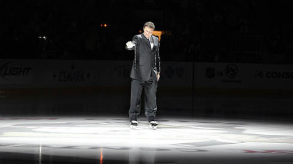 Penguins owner Mario Lemieux pours out water from the Mellon Arena to the ice of the Consol Energy Center prior to Thursday's game.