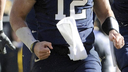 Pitt quarterback Tino Sunseri is elated after running for a first down in the first half.