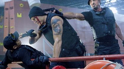 Bullets and bombs run aplenty in "The Expendables," which features an all-star action cast that includes Jet Li, left, Dolph Lundgren and Sylvester Stallone.