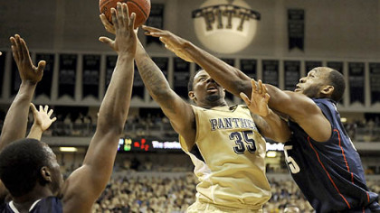 Pitt's Nasir Robinson drives to the net against Connecticut's Charles Okwandu in the first half of Monday's game at the Petersen Events Center.