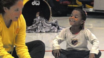 Lauren Coleman, 4, puts her feet together while listening to instructions from Kerra Alexander, of the Pittsburgh Ballet Co., who recently visited Lauren's school, the Early Childhood Education Center in Homewood.