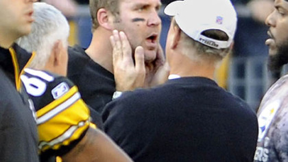 Steelers quarterback Ben Roethlisberger has his jaw  looked at after the Raiders' Richard Seymour took a swipe at him in the second quarter.
