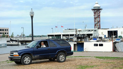Aaron Mathers gets in his car after doing several odd jobs on the Big Tony, his father's commercial fishing boat, as it sits docked at Dobbins Landing at Lake Erie.