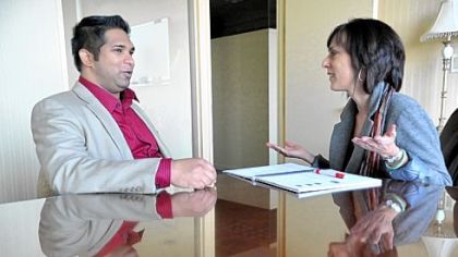 India native Preetham Gowda, a project manager of Teletracking, has a one-on-one English lesson with Judy Tobe.