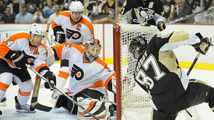 Penguins captain Sidney Crosby loses control of the puck in front of Flyers goaltender Sergei Bobrovsky.