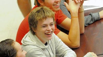 Cameron Clark, a senior at Schenley High School shares a laugh with his classmates at the school's cafeteria.