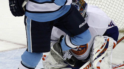 Penguins forward Chris Kunitz screens Islanders goaltender Rick DePietro on a shot in the first period.