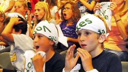 Classmates of Jackie Evancho react to her second-place finish as they watch the television show at the auditorium of Eden Hall Upper Elementary School in Pine-Richland School District.