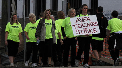 Teachers picket in front of the construction site for the addition to Springdale Junior-Senior High School along Colfax Street. Ninety-four teachers in the Allegheny Valley School District went on strike Thursday morning. They have been working without a contract.