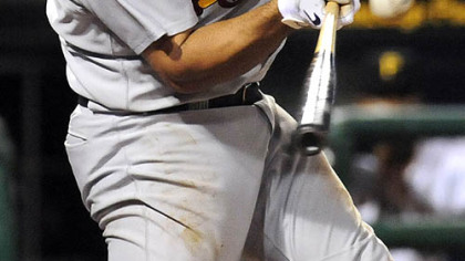 Cardinals Albert Pujois hits a 3-run homer in the first inning.