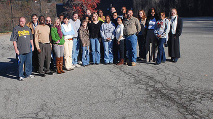 The staff from Pittsburgh Northview PreK-8 pose in the parking lot at the school, which will be turned into a geothermal field.