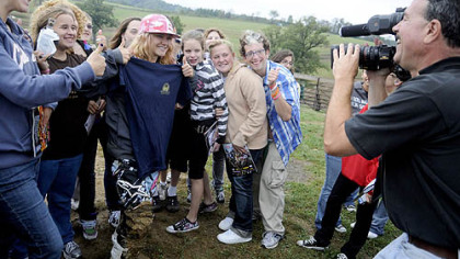 Students from the Western Pennsylvania School for the Deaf get their photo taken with Ashley Fiolek, 19, a motocross athlete who was born deaf. They visited the X Games gold medalist at the Steel City Raceway in Export.