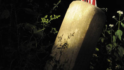 The grave of a soldier from the Civil War era is marked with a flag in the cemetery at the former Dixmont State Hospital in Kilbuck. A group called Ghost Story Investigators filmed its attempts to contact ghosts in the cemetery for a pilot called "Ghost Story TV."
