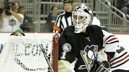 Penguins goaltender Brent Johnson eyes the puck in the corner during Tuesday's game against the Blackhawks at Consol Energy Center.