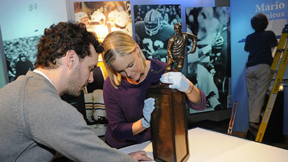 Michael DuBois, director of exhibits and Courtney Keel, registrar and other Heinz History Center and Western Pennsylvania Sports Museum employess set up the "Memories of Mario, at the museum. The exhibit, which features a special collection of trophies, jersey, and sticks on loan from Lemieux  will be on display through Feb 13.