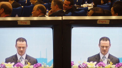 Pittsburgh Mayor Luke Ravenstahl is seen on closed circuit monitors in a conference hall in Shanghai.