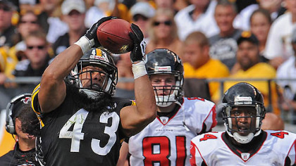Steelers safety Troy Polamalu intercepts pass against the Falcons in the fourth quarter at Heinz Field during Sunday's game.