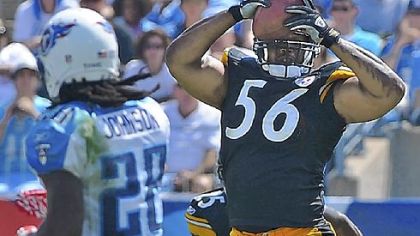 Linebacker LaMarr Woodley intercepts pass from Titans Vince Youing in last week's win in Nashville.
