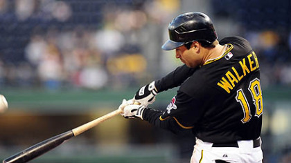 The Pirates' Neil Walker hits a home run in the first inning.