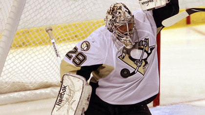 Penguins goalie Marc-Andre Fleury blocks a shot in the first period.
