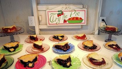 Slices of pie filled with berries from Sand Hill Berries in Westmoreland County are for sale in the gardens of the farm. 