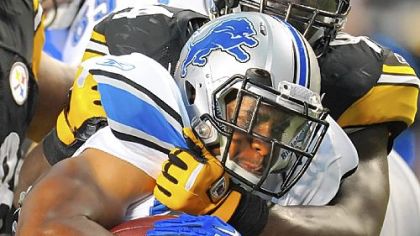 Lawrence Timmons wraps up Detroit's Jahvid Best in the first half before the rains came to Heinz Field just before halftime Saturday night.